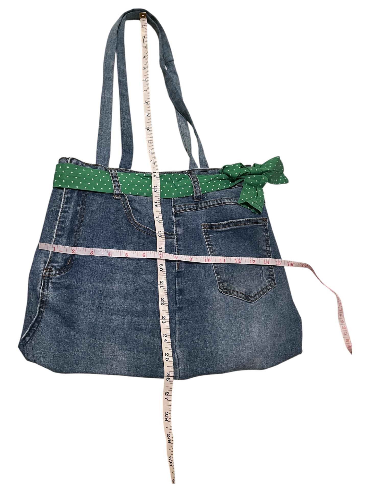 Light blue denim Jean bag with white polka dots and green.